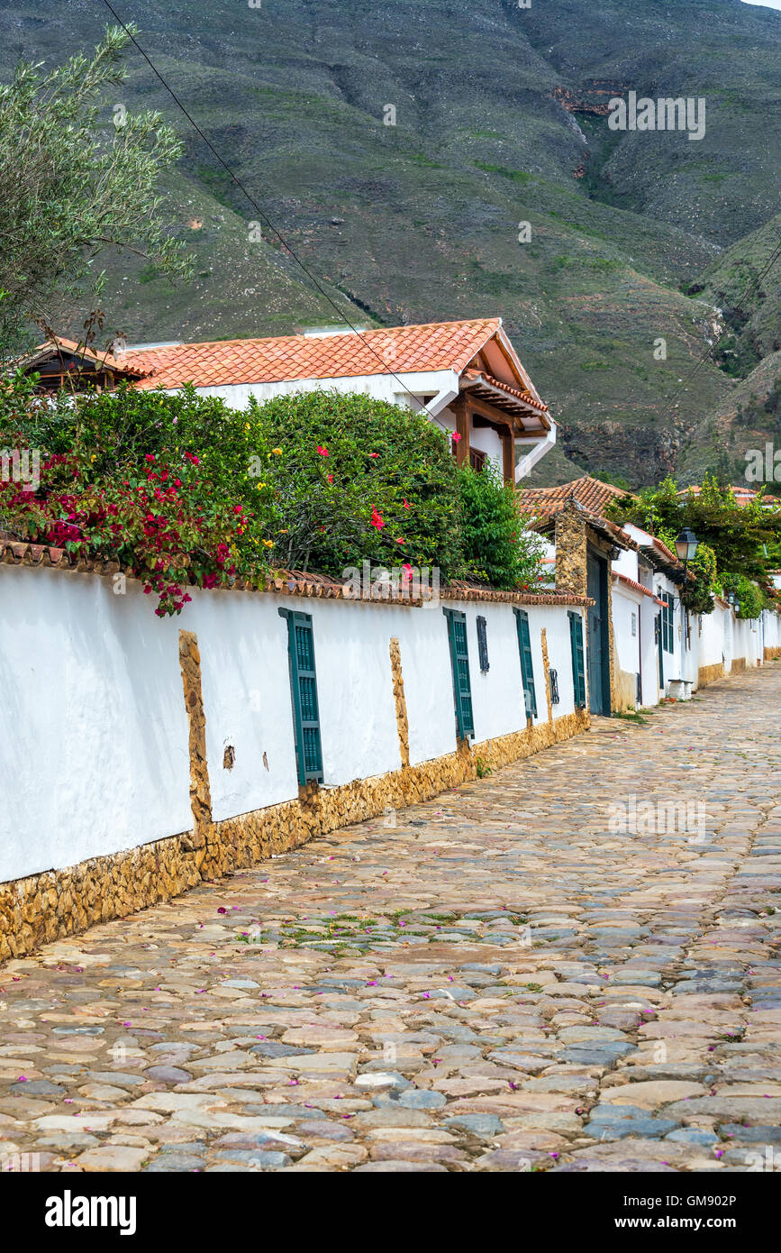 Cobblestone street and white colonial architecture in Villa de Leyva, Colombia Stock Photo