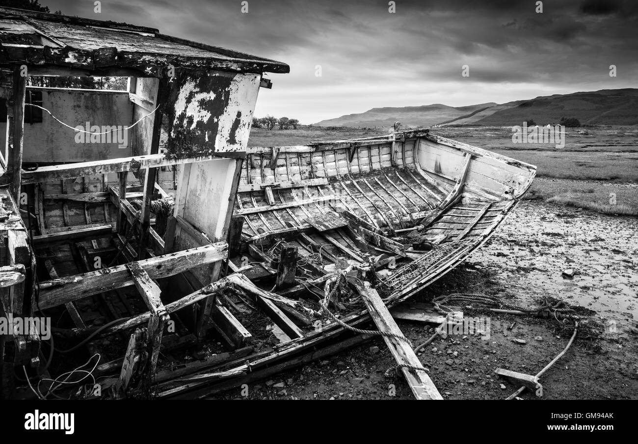 b&w wrecked fishing boat on shore Stock Photo