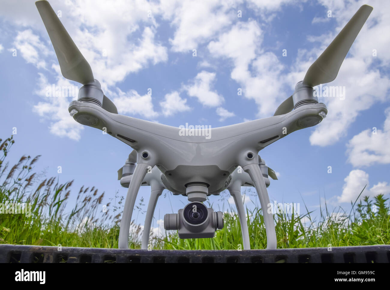 Quadrocopters on a plastic box in the grass. Preparation quadrocopter to fly. Stock Photo