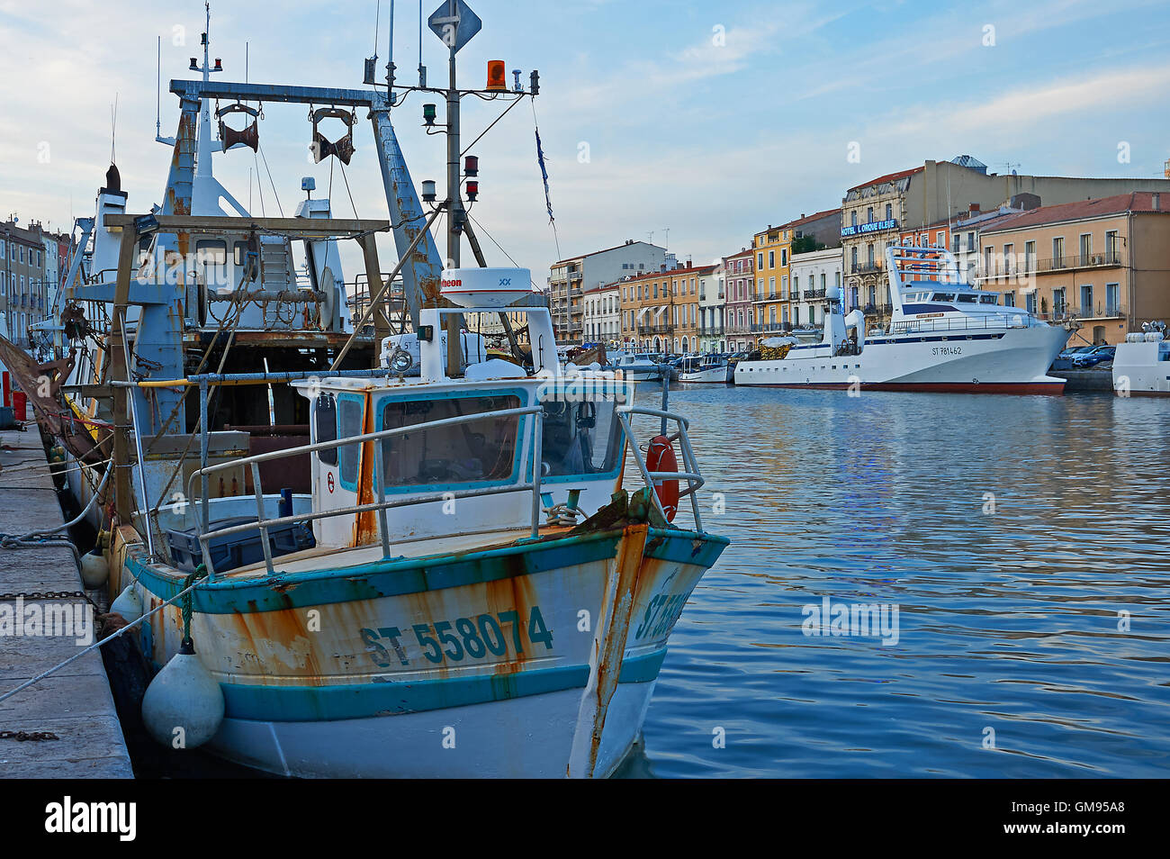 Boats in the harbour canal system in the southern French town of Sete Stock Photo