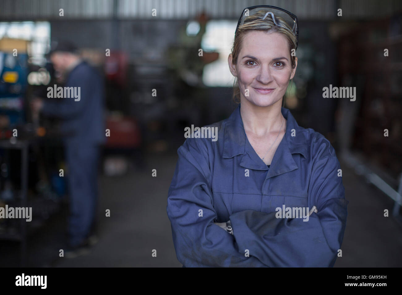 Portrait of confident female mechanic in workshop Stock Photo