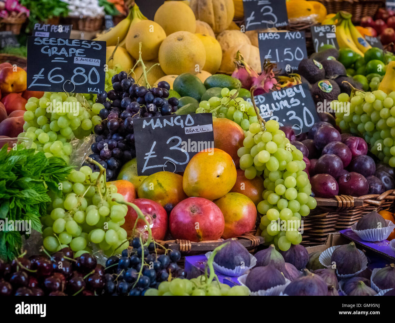 Various fresh fruits on display on a stall at Borough Market in London