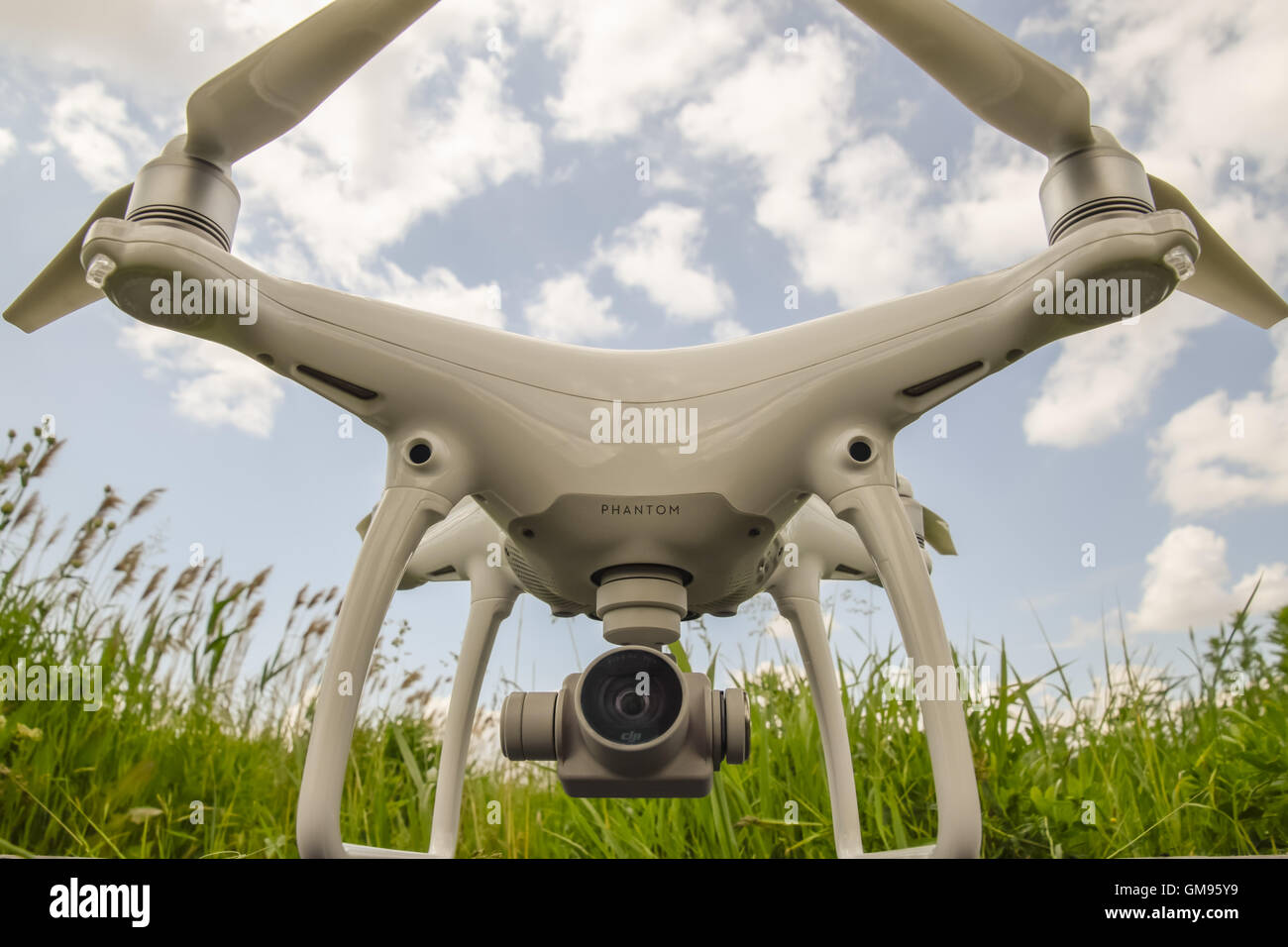 Russia, Poltavskaya village - May 1, 2016: Quadrocopters on a plastic box in the grass. Preparation quadrocopter to fly. Stock Photo