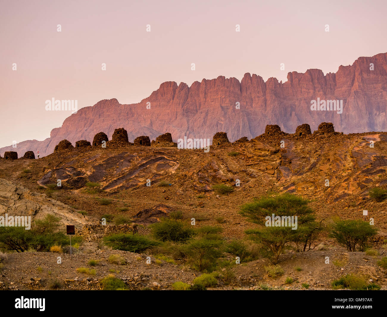 Oman, Ad-Dakhiliyah, Jabal Misht, Al-Ain, beehive tombs, site of an excavation in the evening Stock Photo