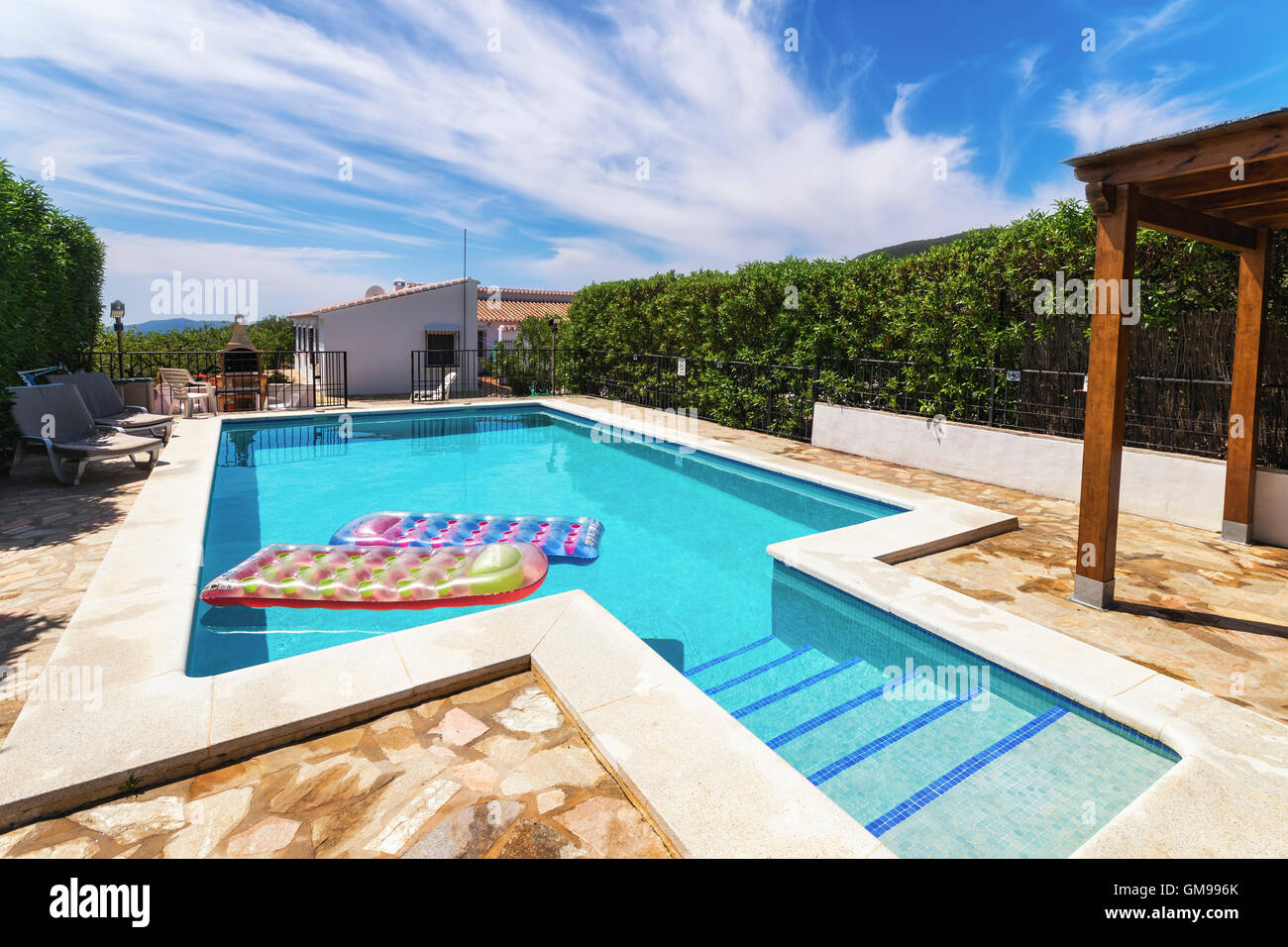 Spain, Andalucia, Finca and swimming pool with airbeds Stock Photo