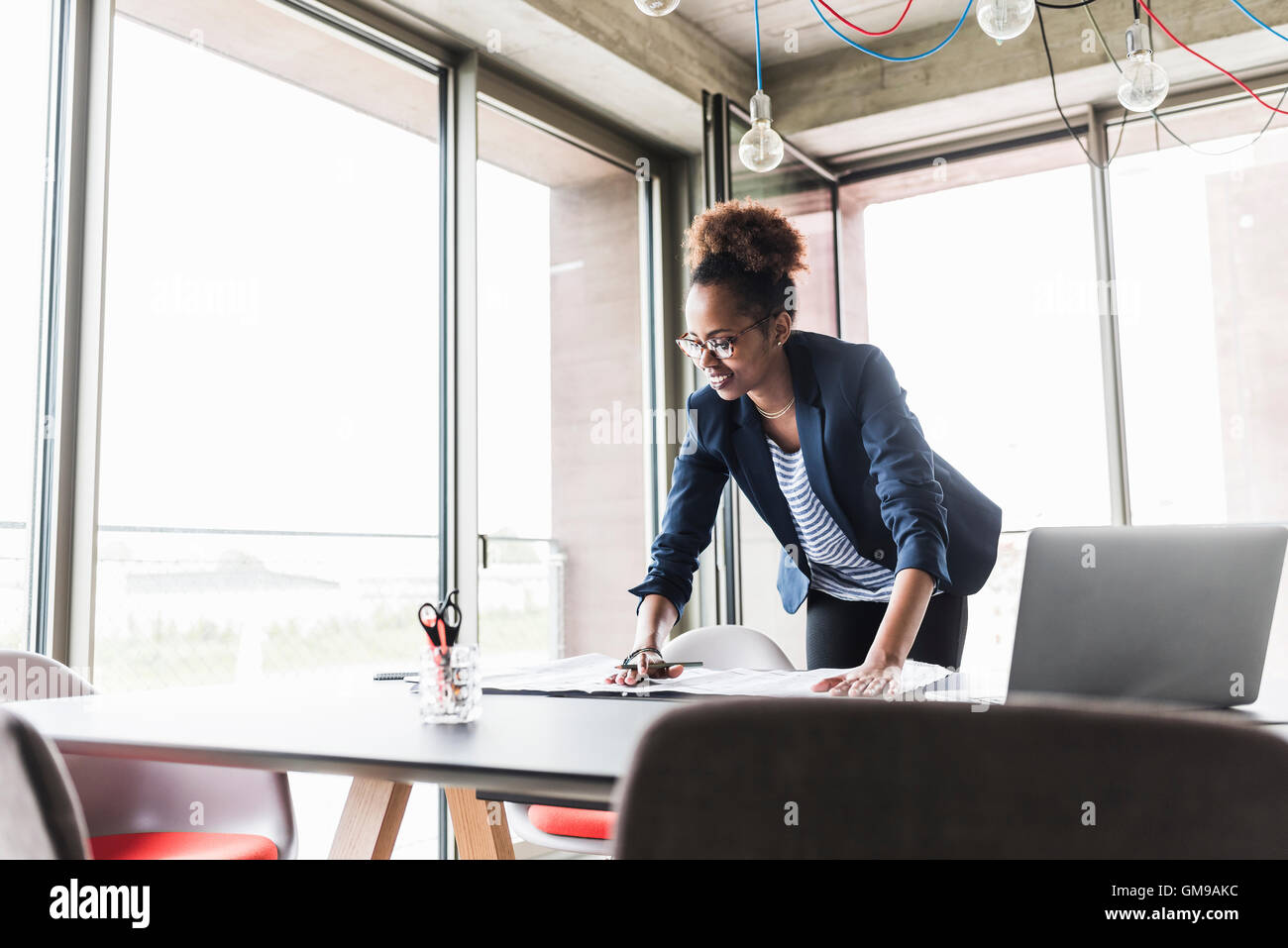 Businesswoman in office Stock Photo - Alamy