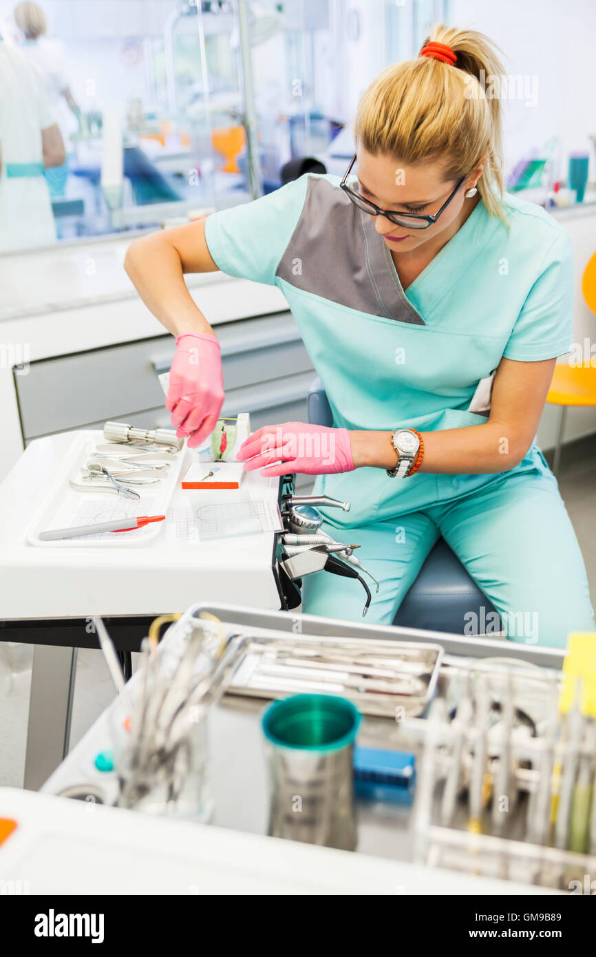Dentist preparing tooth polish Stock Photo Alamy