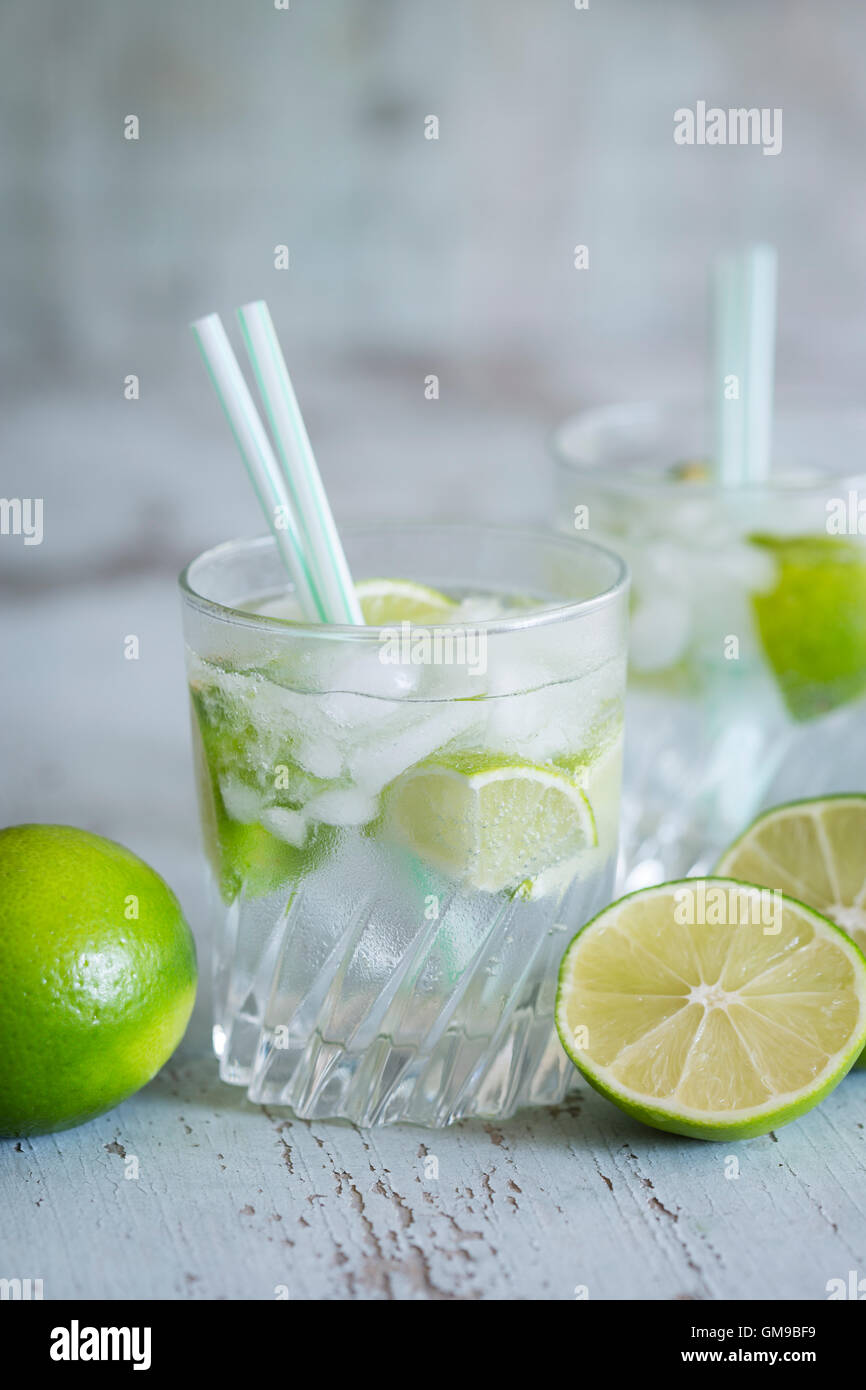 Glasses of infused water with lime and ice cubes Stock Photo - Alamy