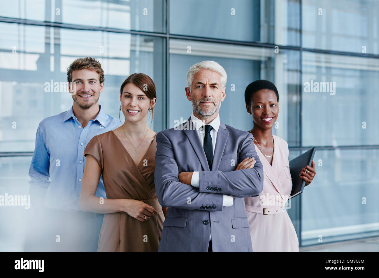 Portrait of confident business team Stock Photo - Alamy