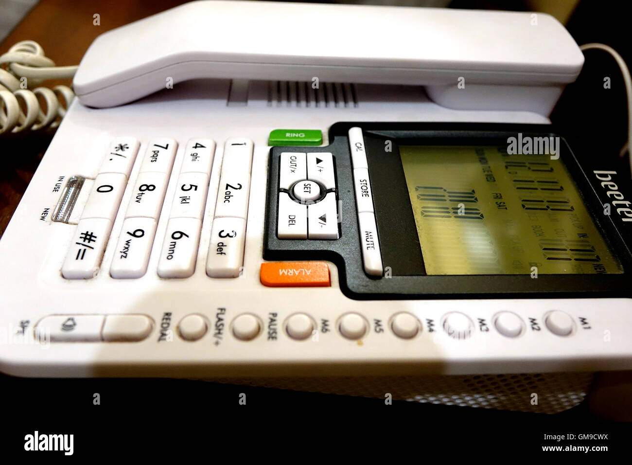 Telephone devices at office desk Stock Photo