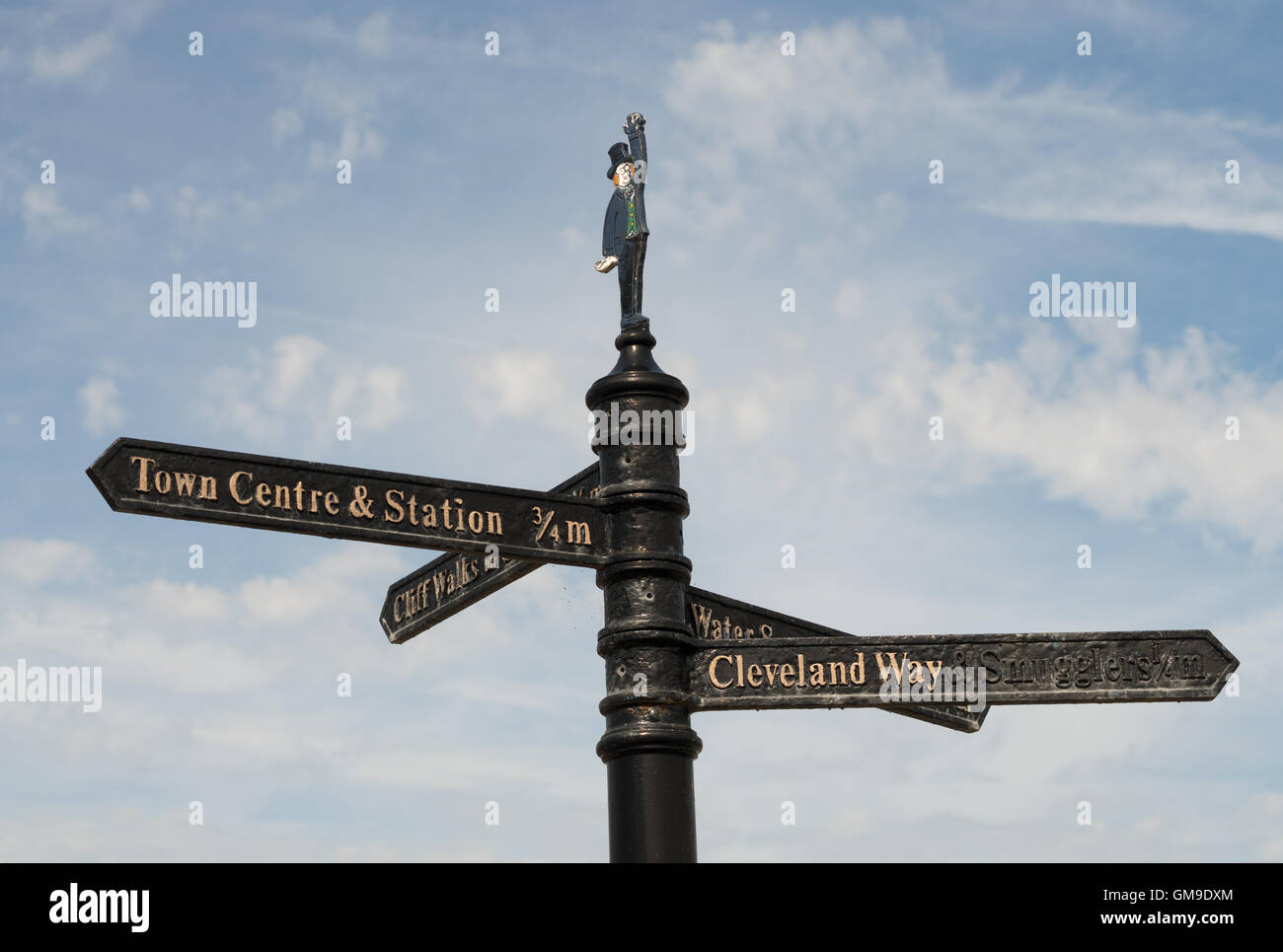 Cast iron direction signpost with figure of Henry Pease, Saltburn by the Sea, North Yorkshire, England, UK Stock Photo