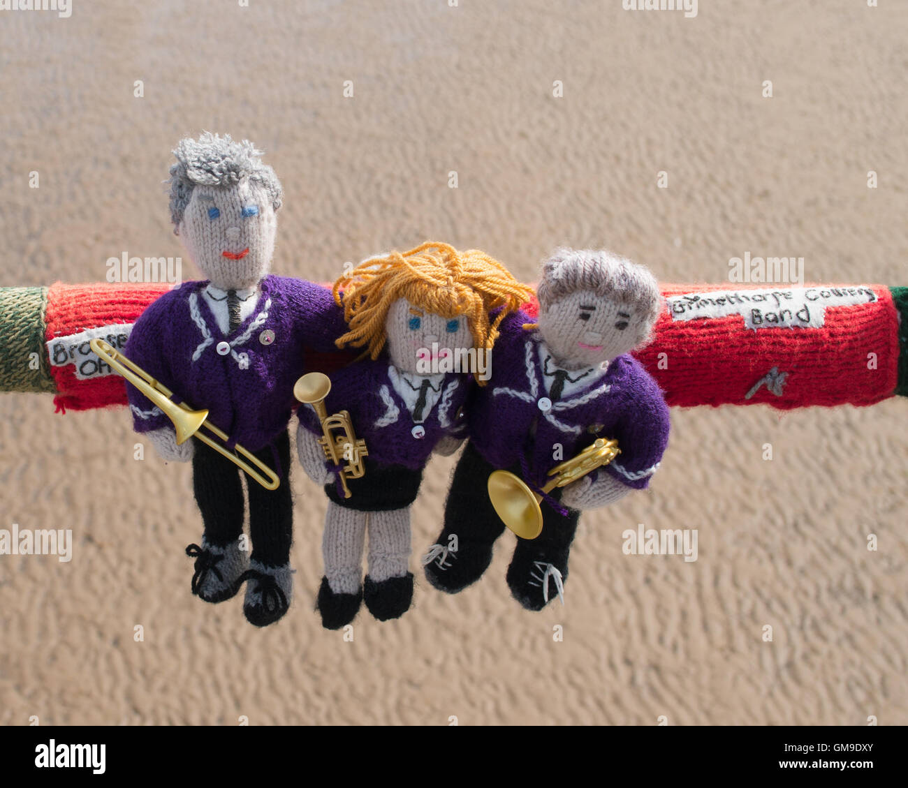 Knitted brass band players with text Grimethorpe Colliery Band on the pier at Saltburn by the Sea, North Yorkshire, England, UK Stock Photo