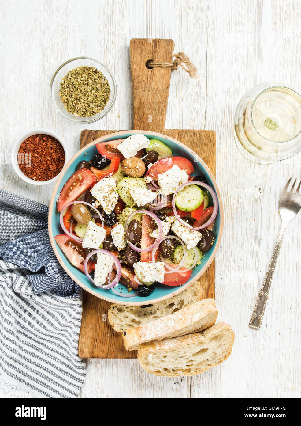 Greek salad with bread slices, oregano, pepper and white wine Stock