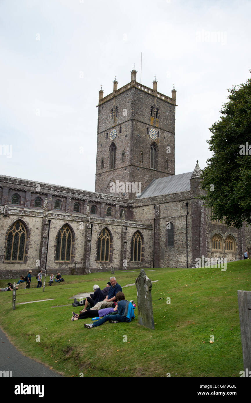 Wales St David's Cathedral, Pembrokeshire. people rest in the graveyard Stock Photo