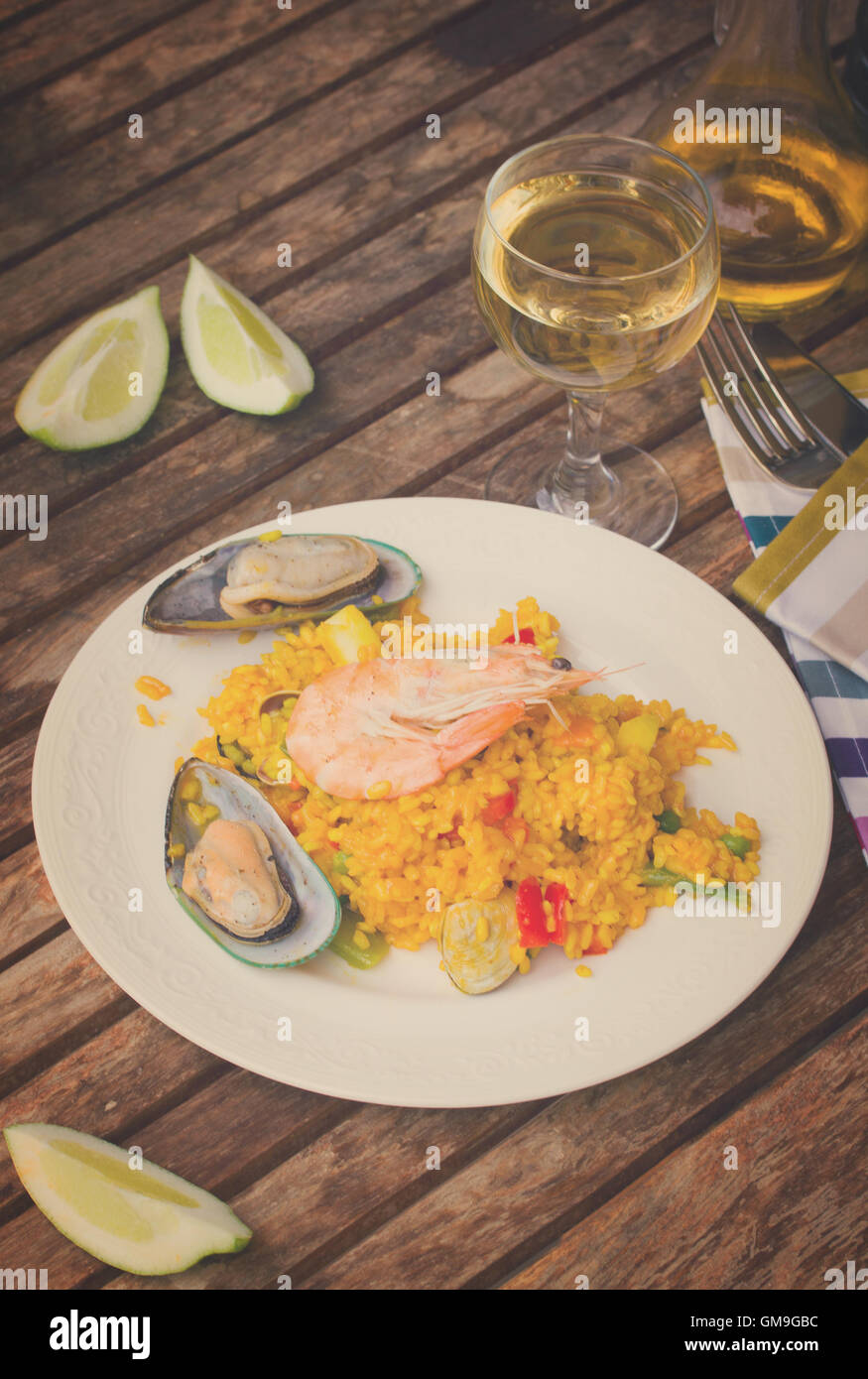 Dining with seafood paella Stock Photo Alamy