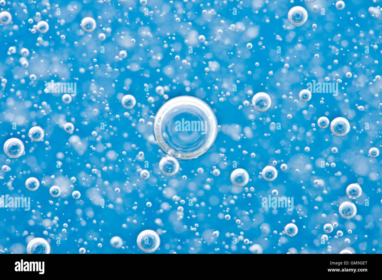 https://c8.alamy.com/comp/GM9GET/bright-bubbles-motion-under-water-on-blue-background-macro-concept-GM9GET.jpg