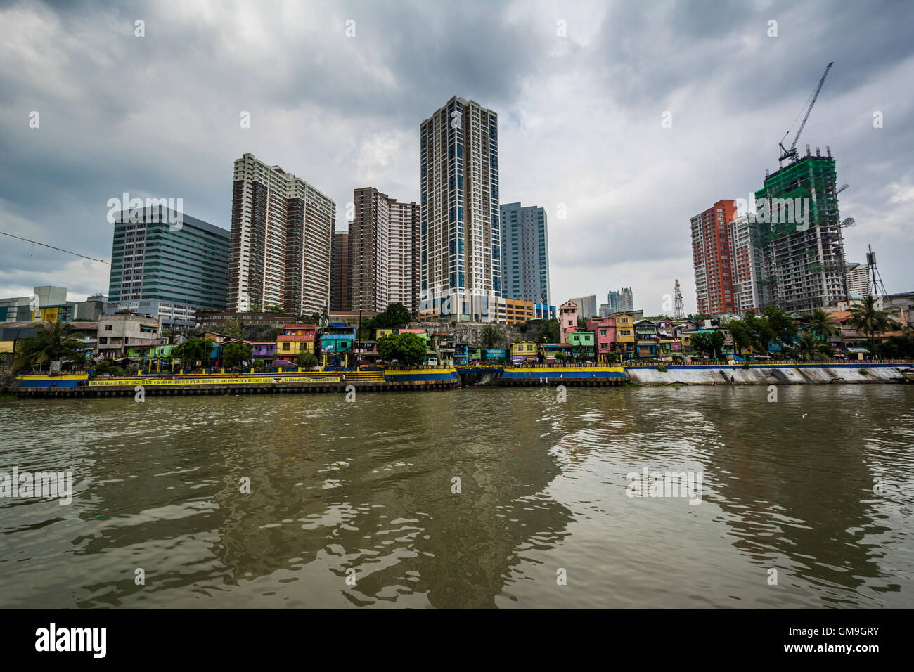 Buildings in Mandaluyong and the Pasig River seen from Makati, Metro Manila, The Philippines. Stock Photo