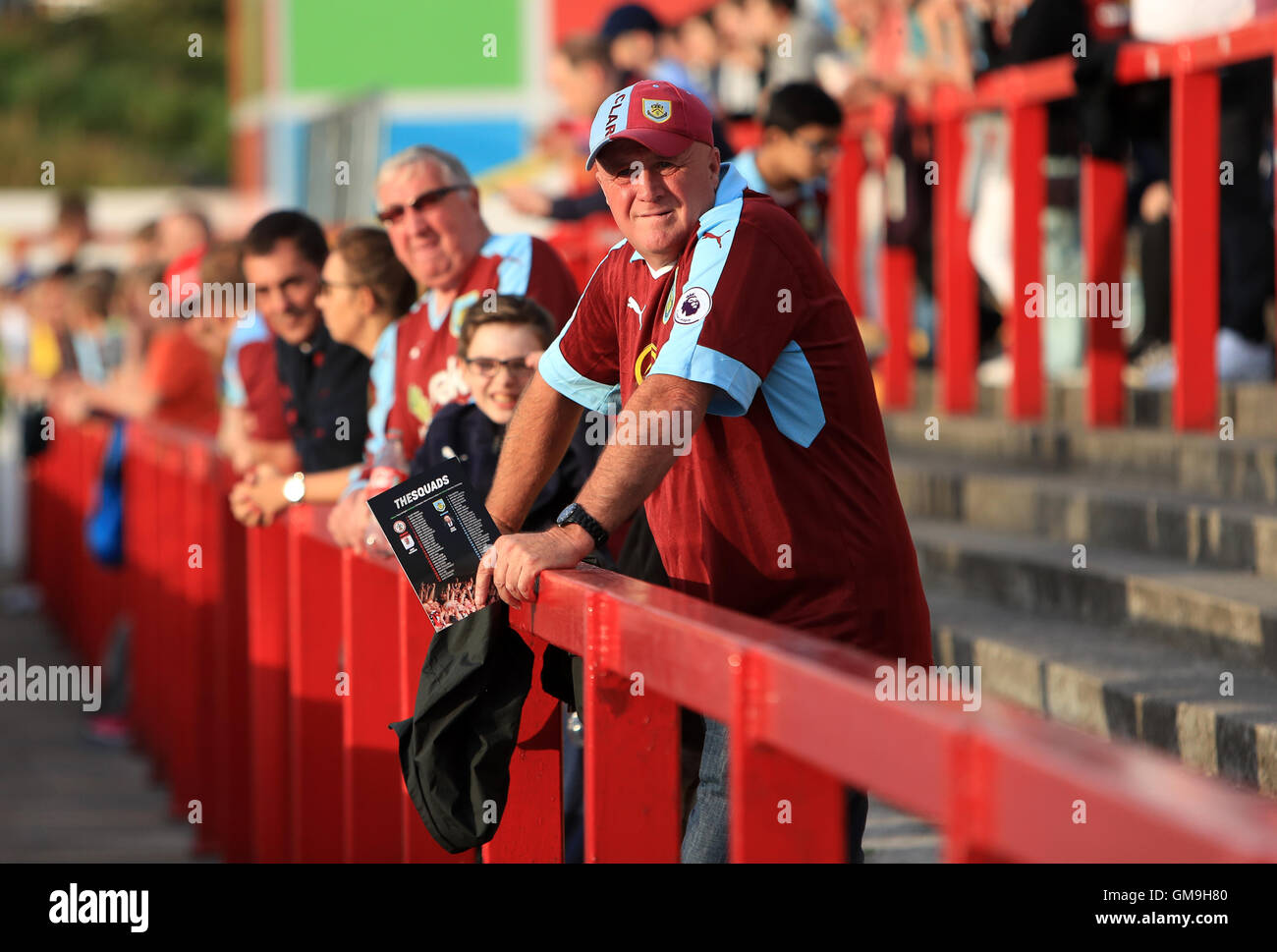 Burnley supporters soak up the evening sun ahead of the EFL Cup, Second Round match at the Wham Stadium, Accrington. Stock Photo