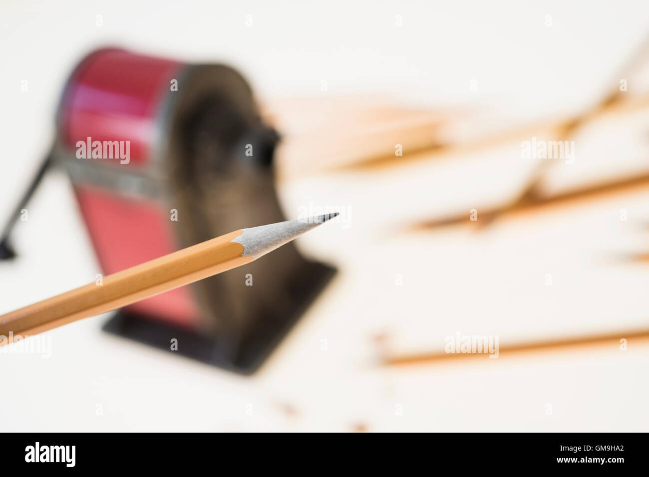 Pencil and antique pink pencil sharpener Stock Photo