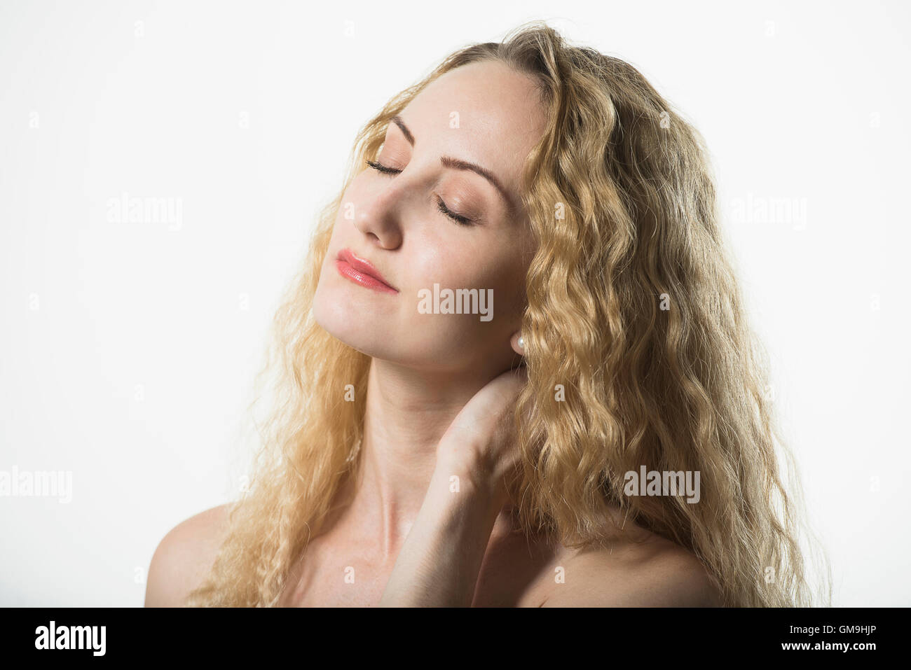 Portrait of beautiful woman with long, blond, curly hair Stock Photo ...