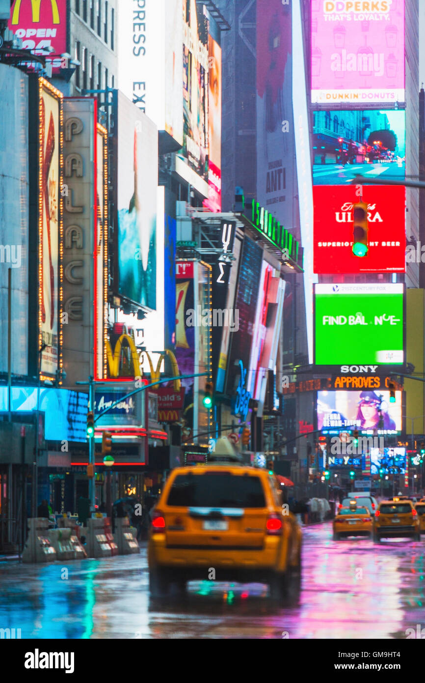 New York City, Car driving through street illuminated by neon lights Stock Photo