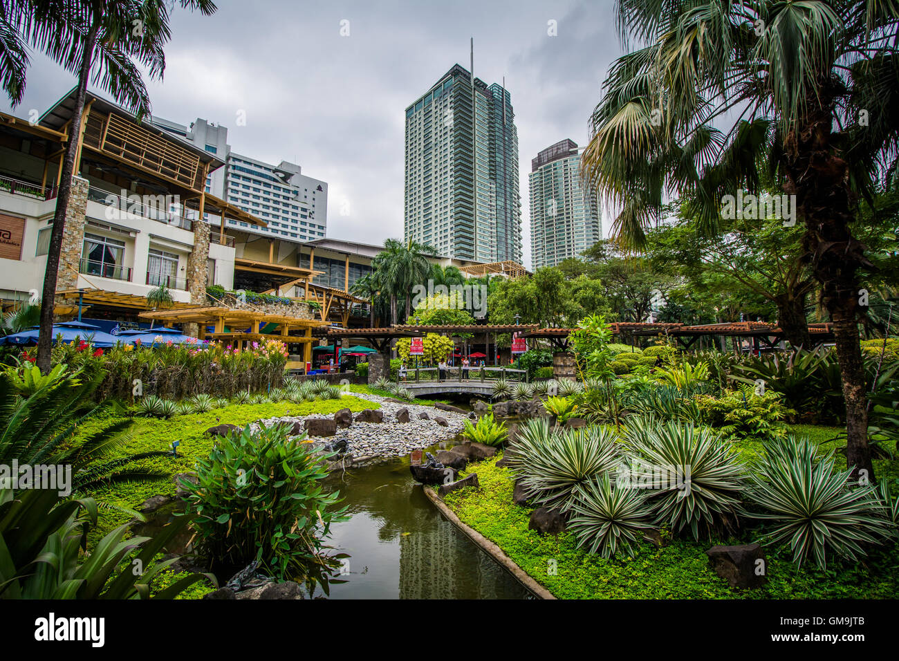Gardens and skyscrapers at Greenbelt Park, in Ayala, Makati, Metro