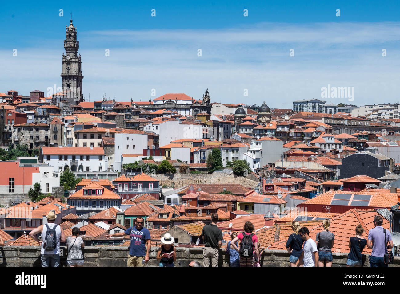 Tourists viewing the city from the terrace of Se Cathedral, Porto, Portugal. Stock Photo