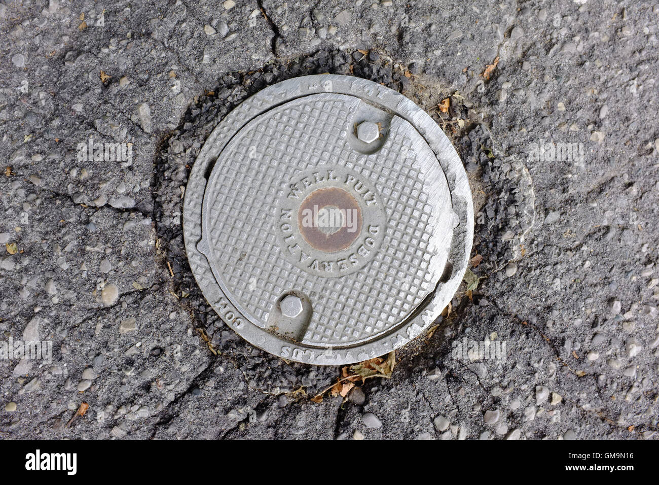 A small round metal drain cover in Ontario, Canada Stock Photo Alamy
