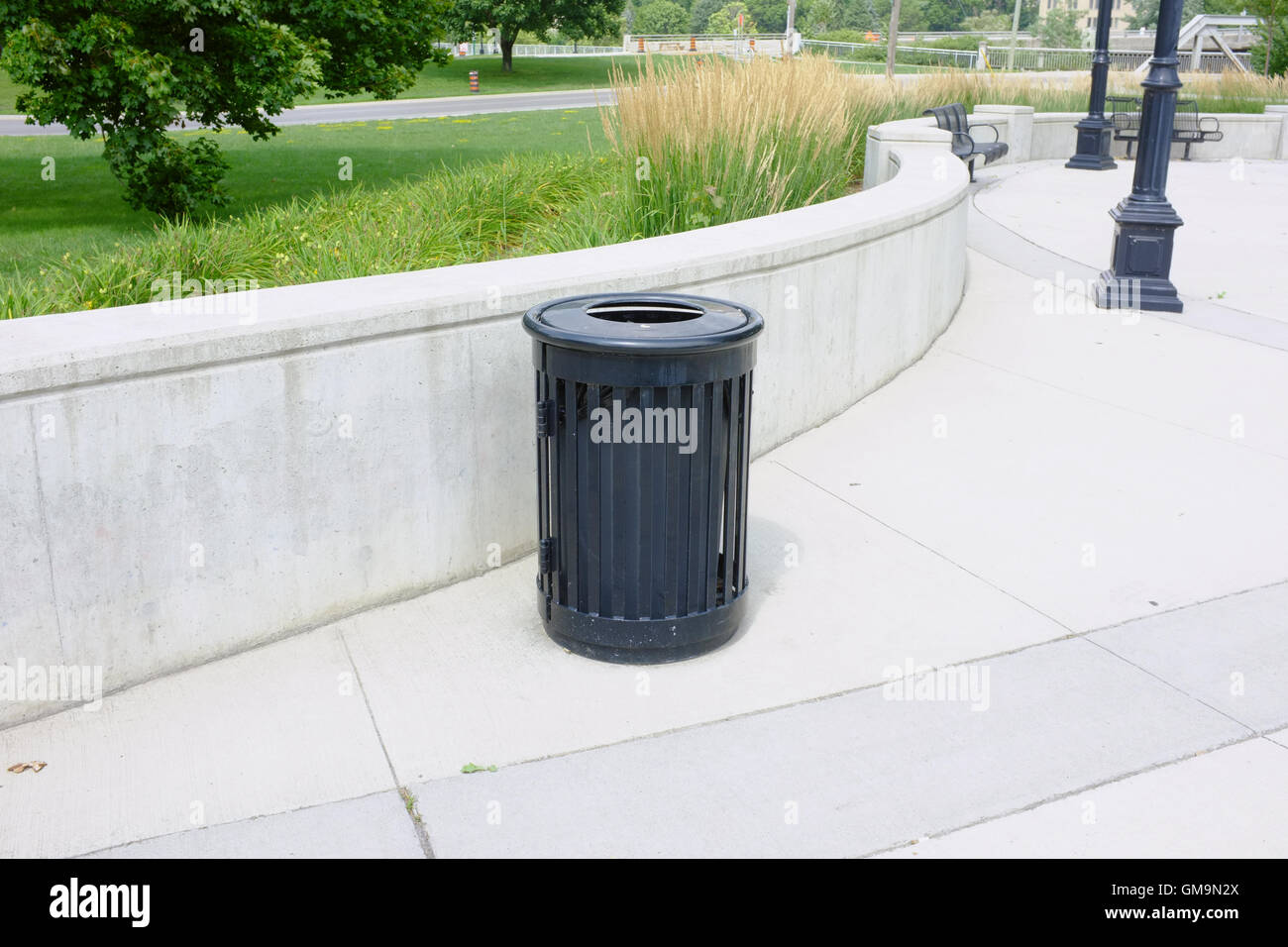 A Canadian rubbish bin on the side of a park in London, Ontario Stock