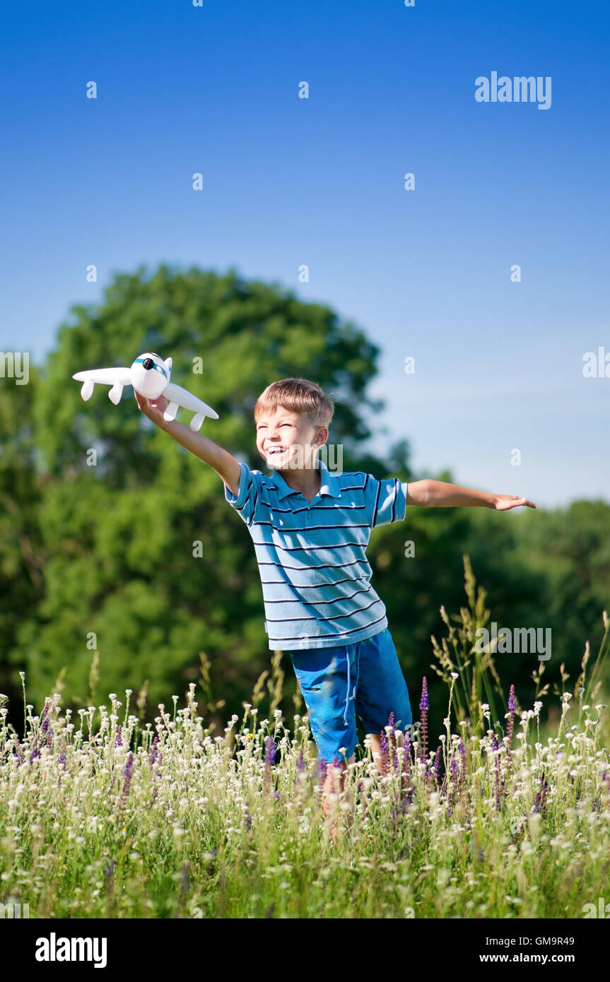 Boy with toy airplane Stock Photo