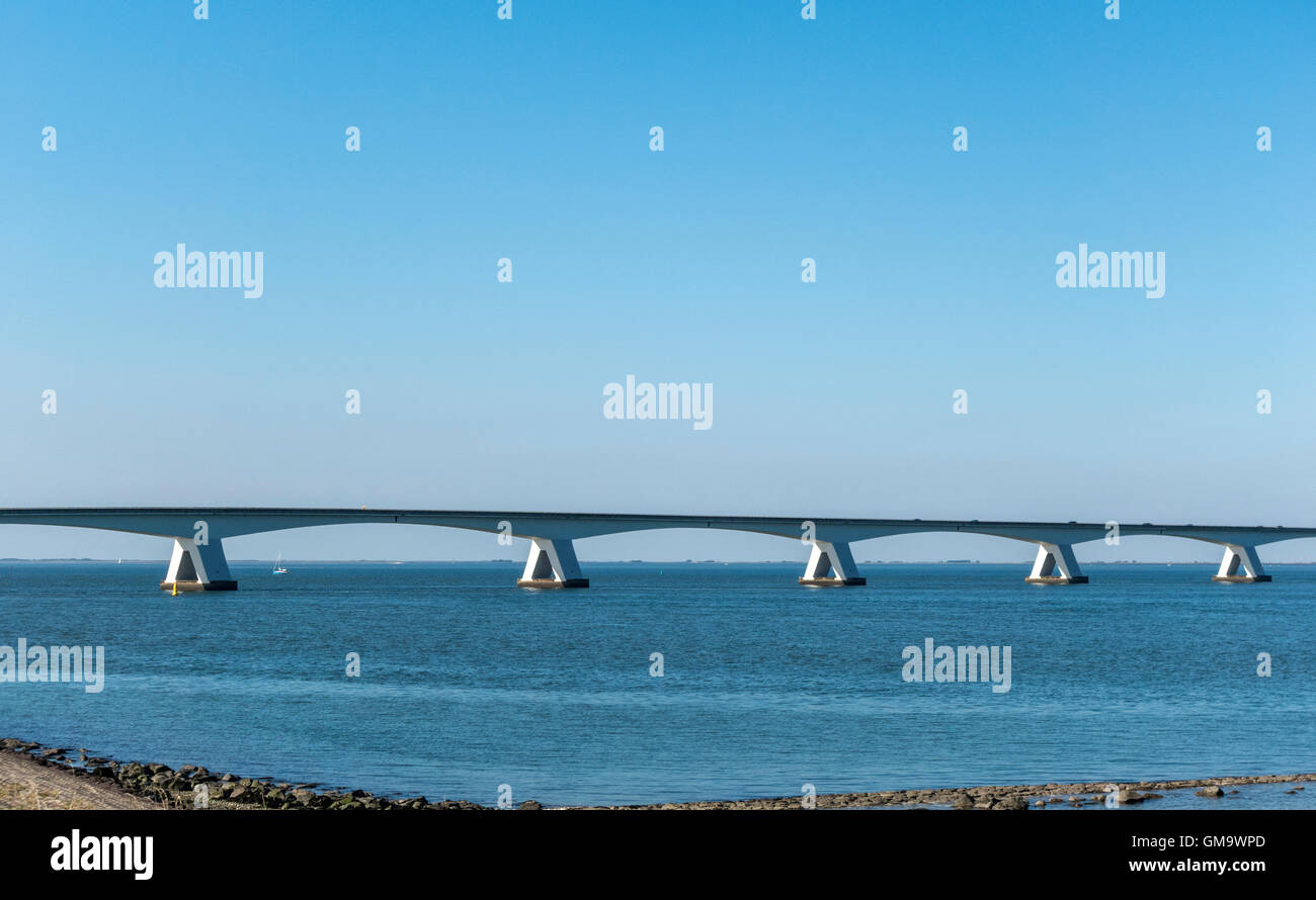 The Zeeland Bridge (Dutch: Zeelandbrug) is the longest bridge in the Netherlands. It spans the Oosterschelde estuary. Stock Photo