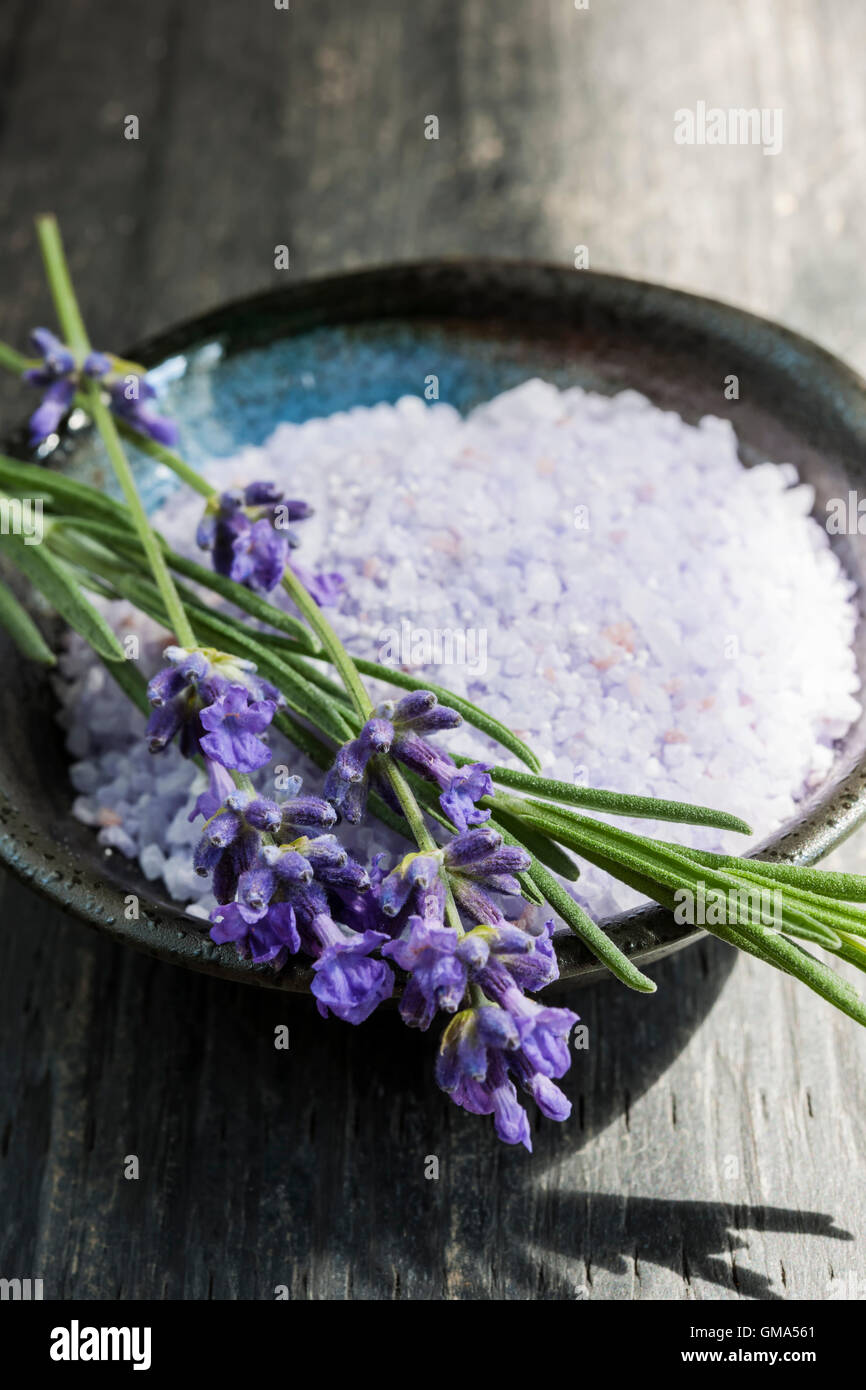 Lavender bath salts herbal body care product in dish with fresh flowers close up Stock Photo