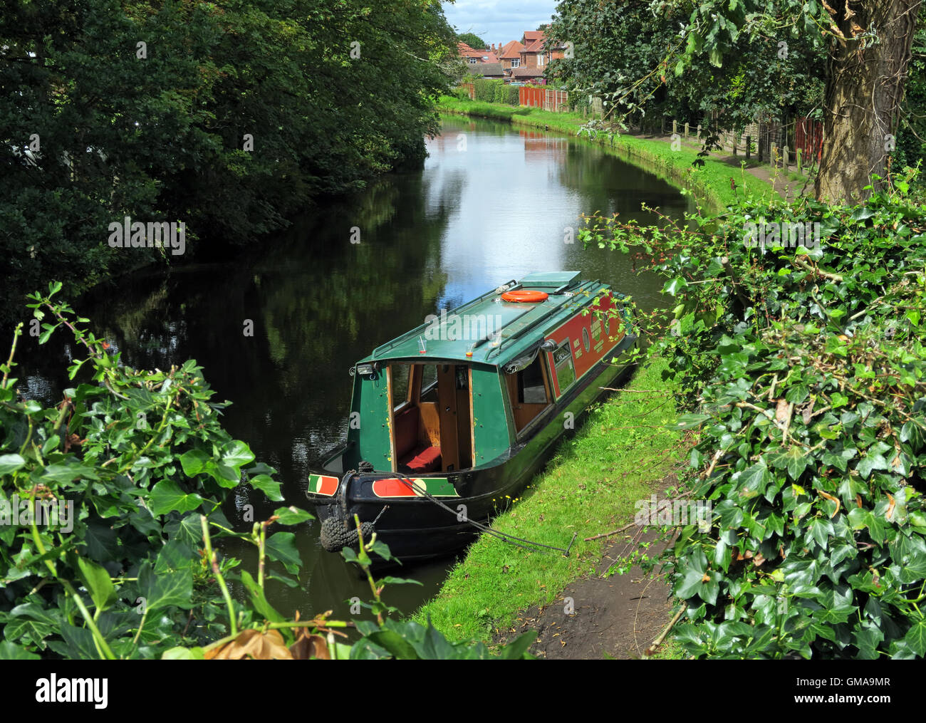 Narrowboat barge, boat moored on the Bridgewater Canal, Grappenhall village, Warrington, Cheshire, WA4 2PL, in summer Stock Photo