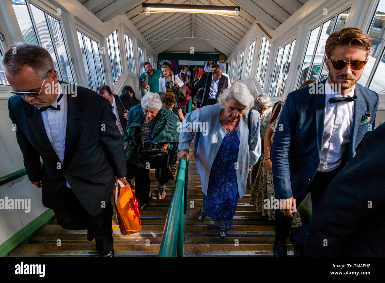 Opera Fans Arrive At Lewes Station En Route To Glyndebourne Opera House, Lewes, Sussex, UK Stock Photo