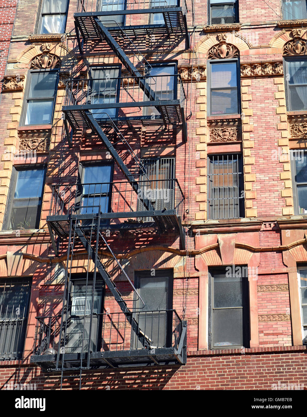 Fire escape on exterior of walk up apartment building in New York City ...