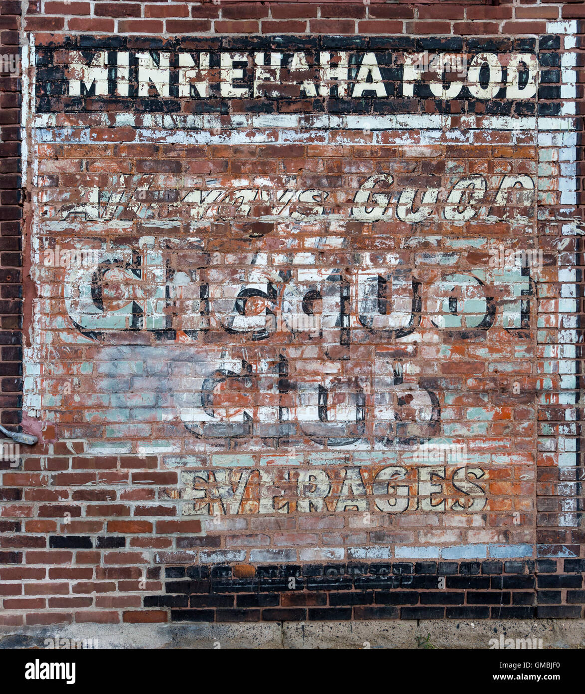 Faded and eroded hand-painted sign for Clicquot Club Beverages in St. Paul, Minnesota Stock Photo
