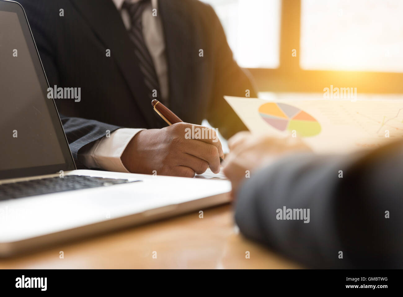 businessman meeting, analyzing and discussing with computer and ...
