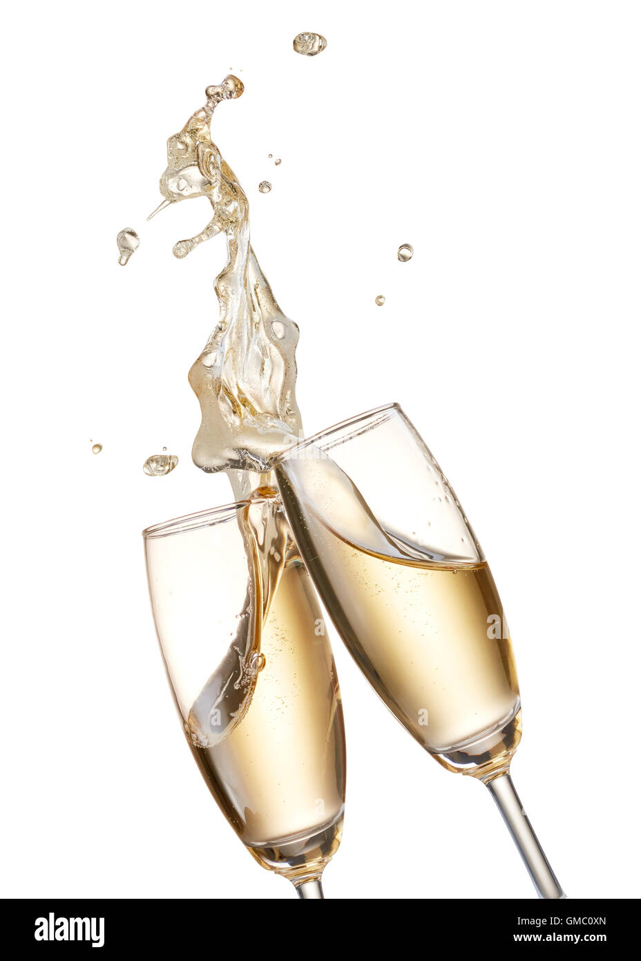 two glasses of champagne toasting creating splash Stock Photo - Alamy