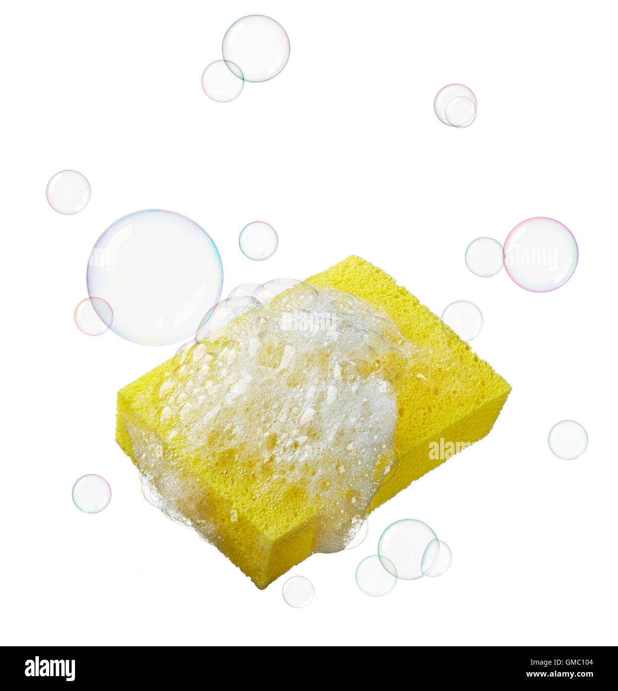 yellow sponge with lots of soaps and bubbles Stock Photo