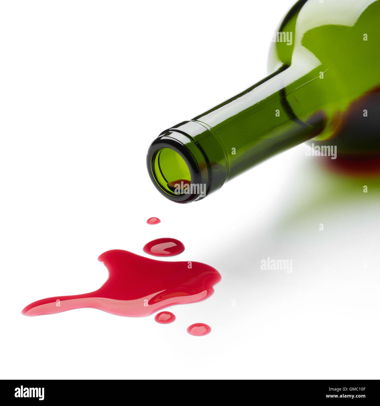 red wine spilling from the bottle Stock Photo