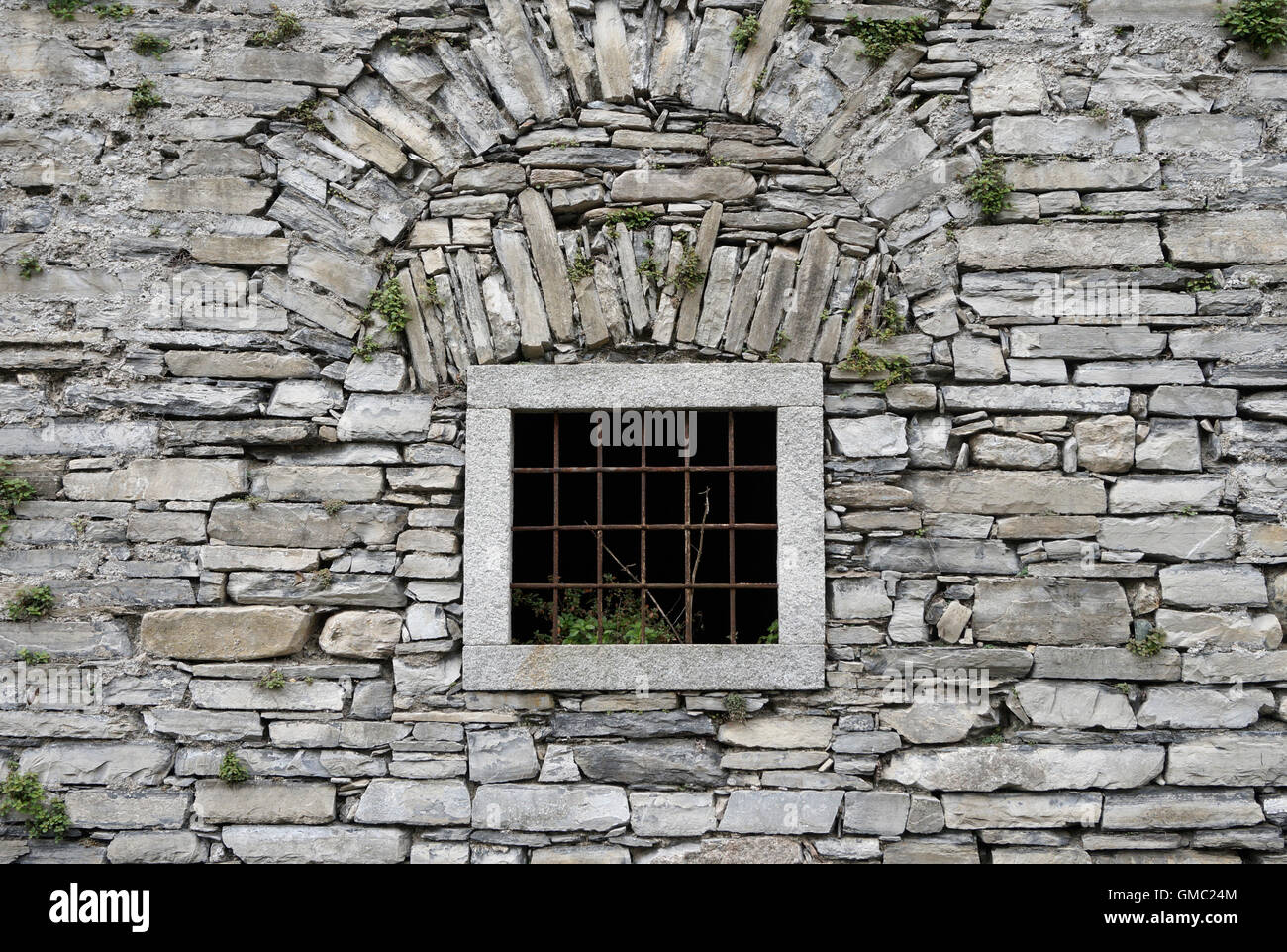 window with bars in a ancient stone wall Stock Photo - Alamy