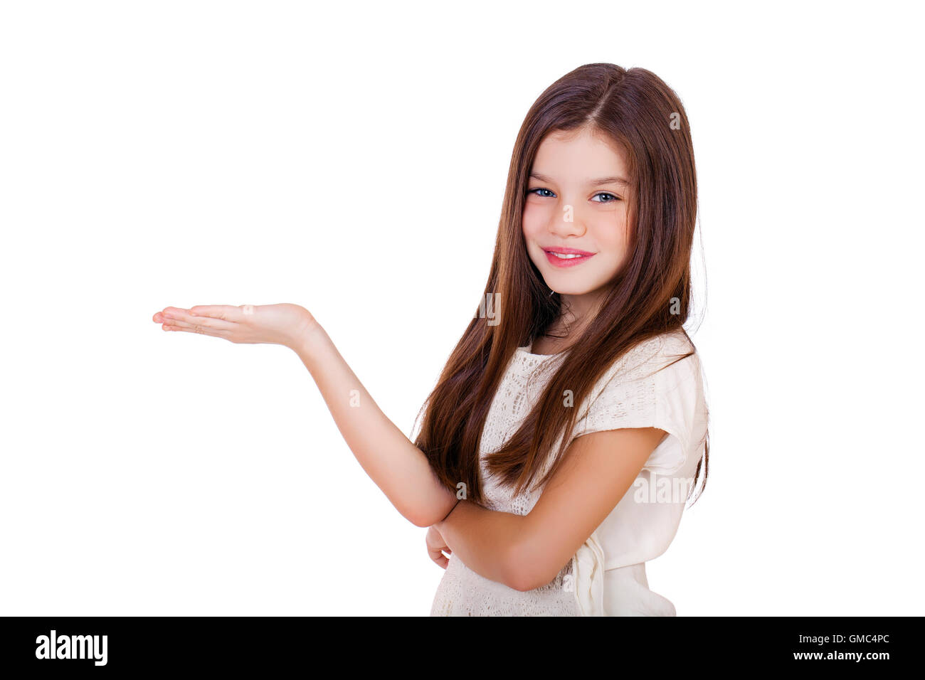 Portrait of a charming little girl smiling at camera, isolated on white ...