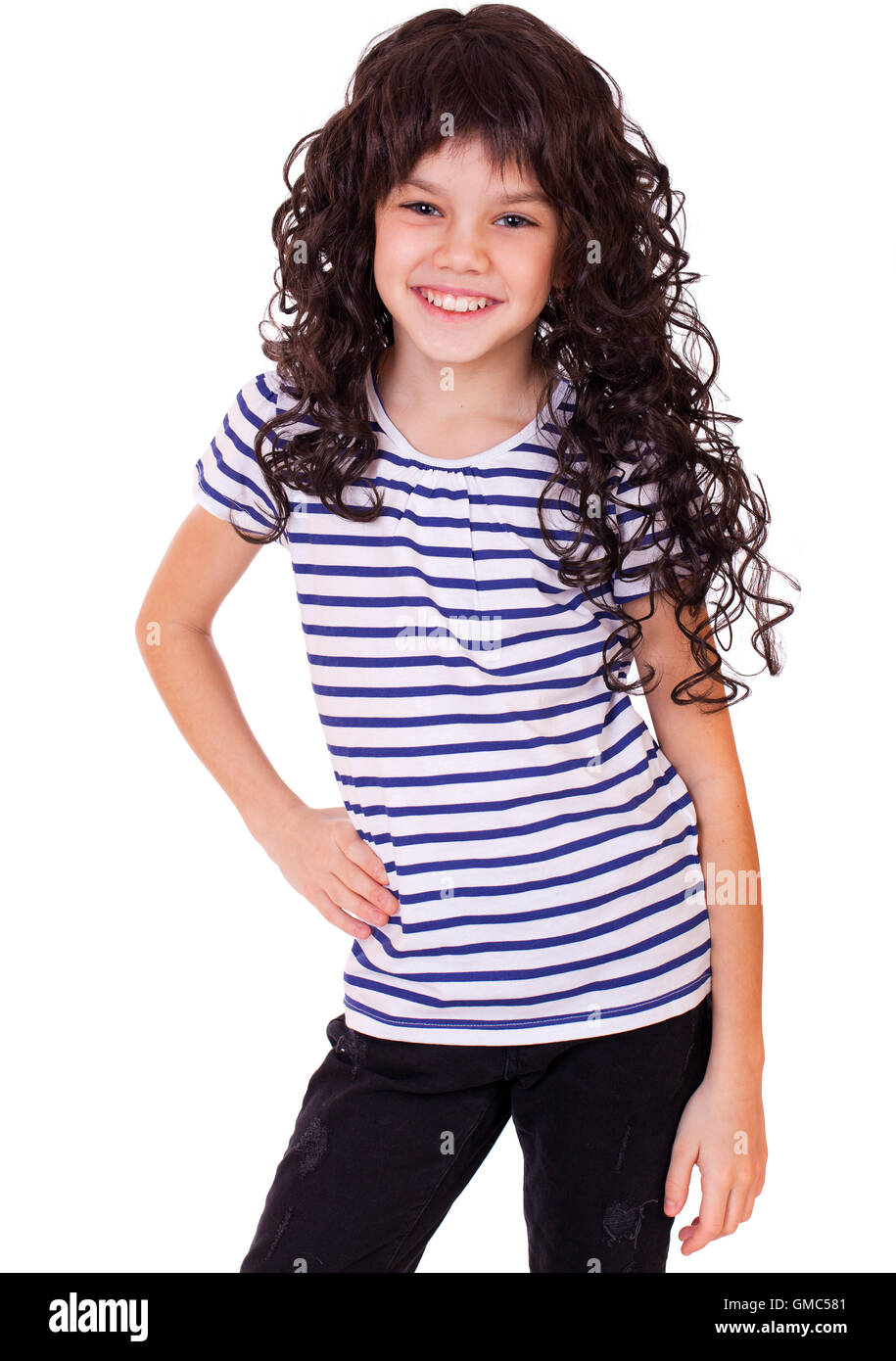 Portrait of a charming little girl smiling at camera, isolated on white ...
