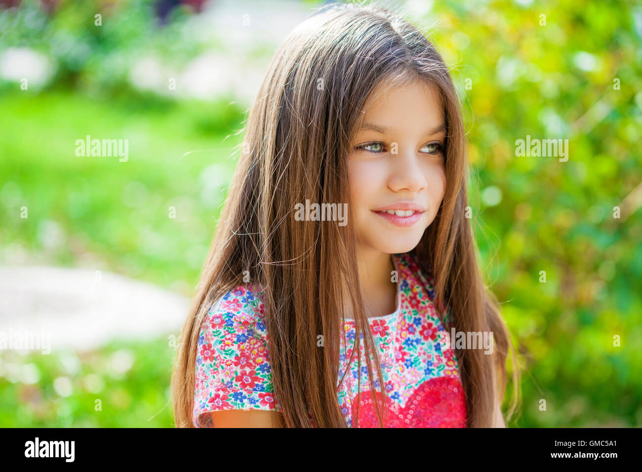 Beautiful Happy little girl outdoors Stock Photo