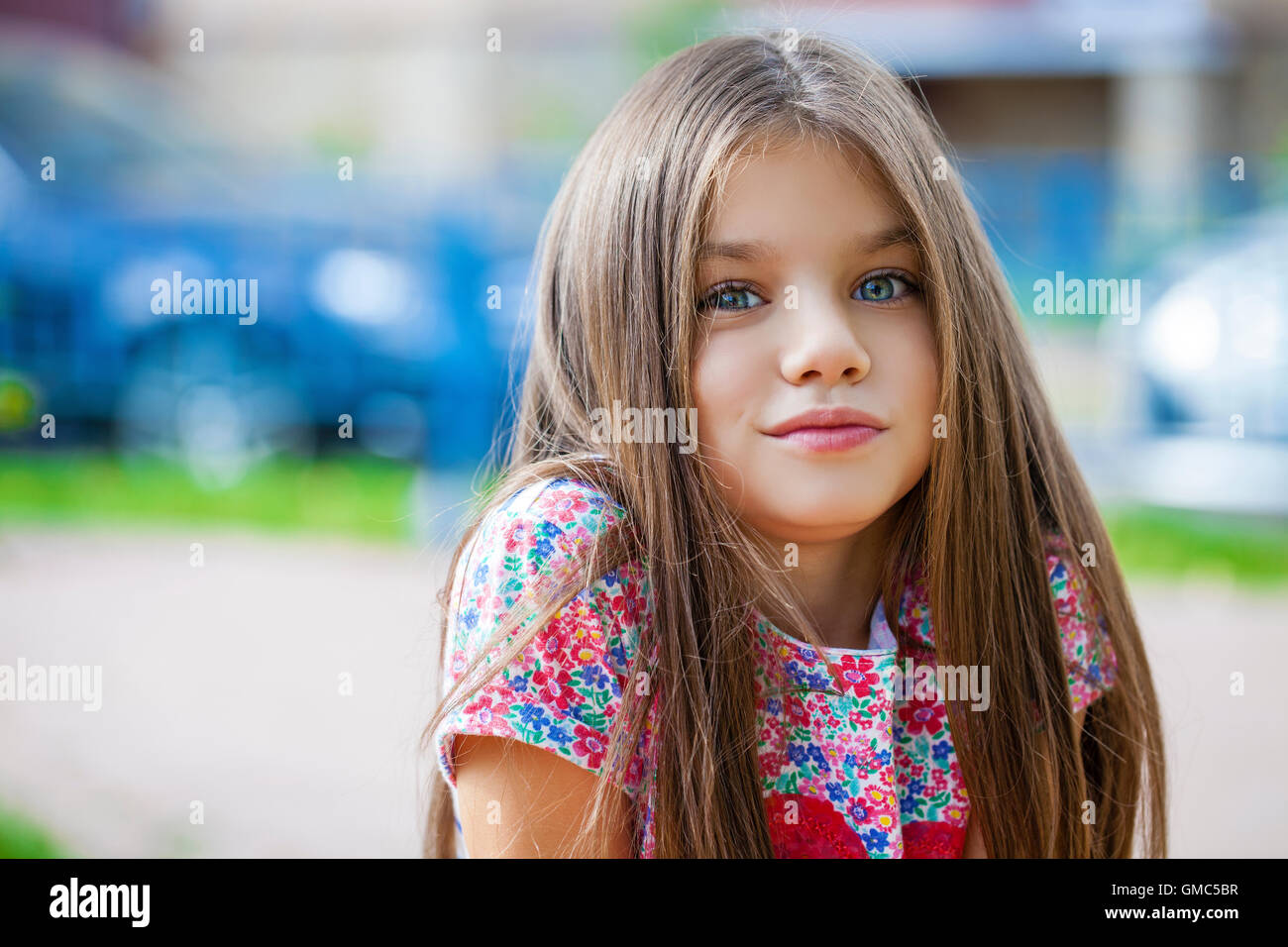 Close up portrait of a beautiful nine year old little girl in autumn park Stock Photo