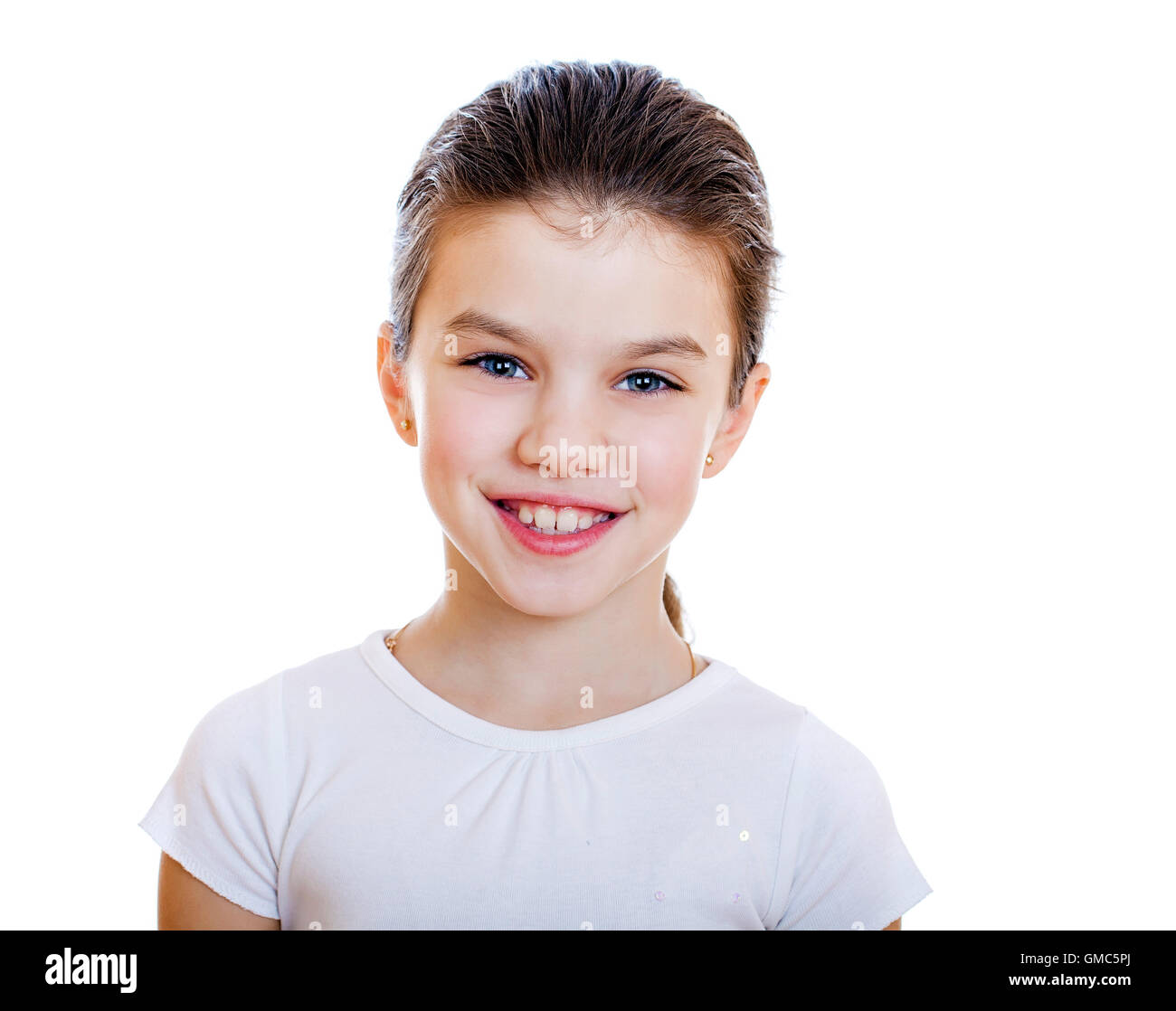 Portrait of a charming little girl smiling at camera, isolated on white ...