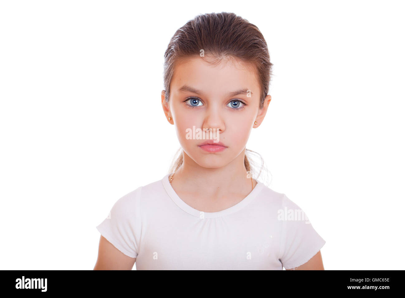 Portrait of a charming little girl smiling at camera, isolated on white ...
