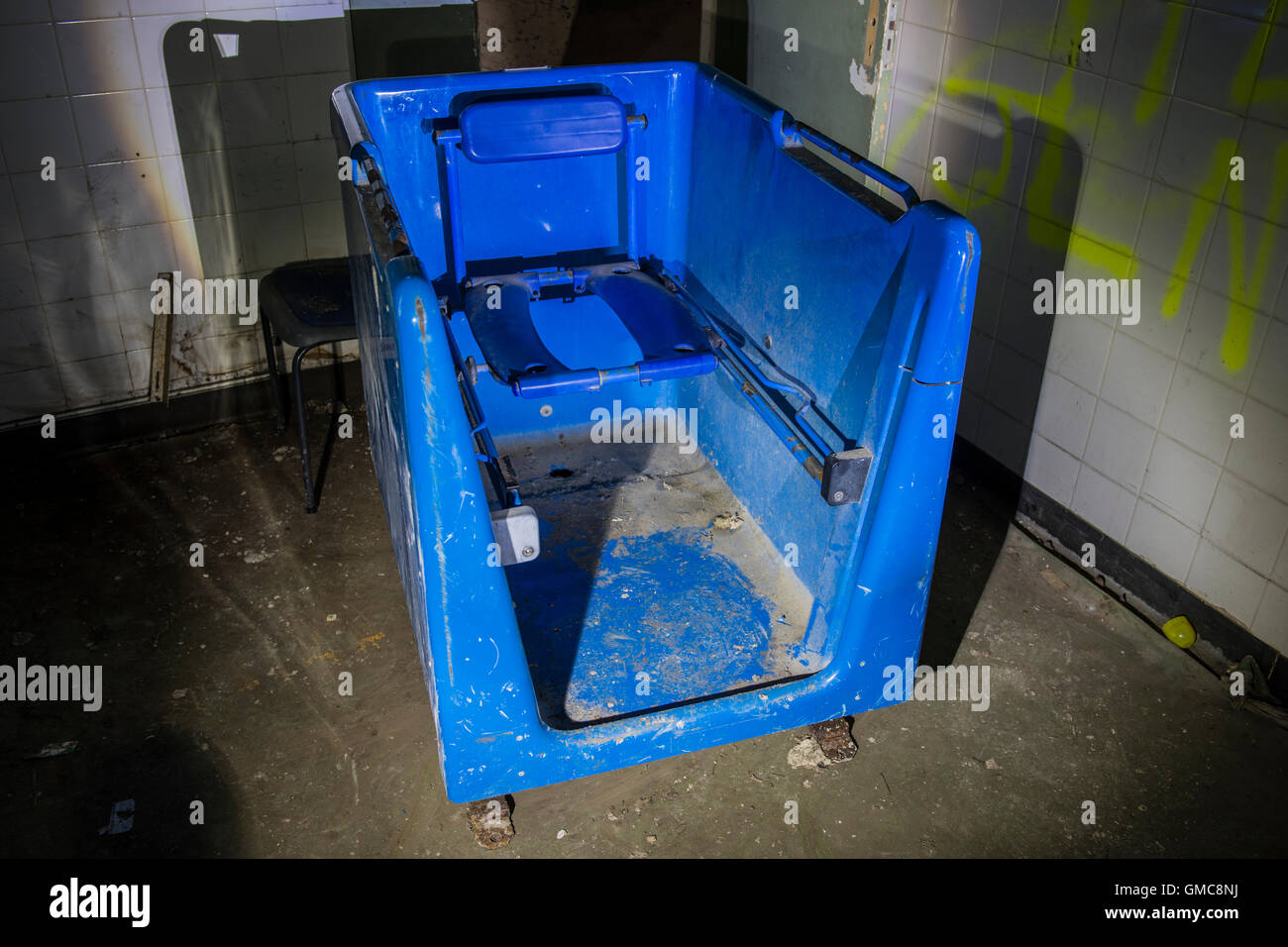 Patients bathing chair within  Denbigh Asylum, Denbigh, Denbighshire, Wales, UK Stock Photo