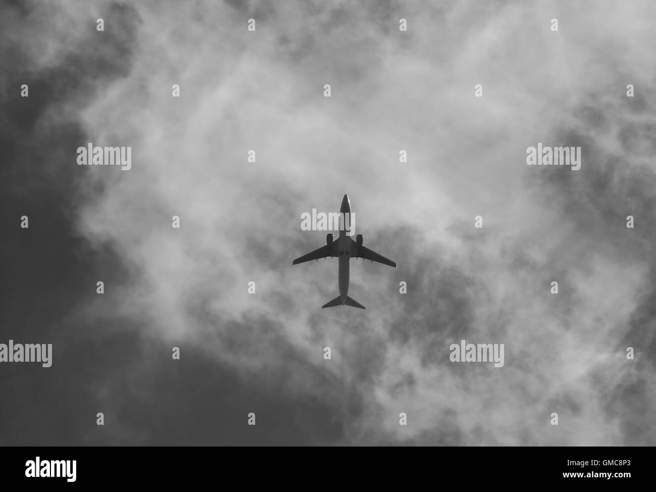 Civil aircraft cloud sky in black and white Stock Photo - Alamy