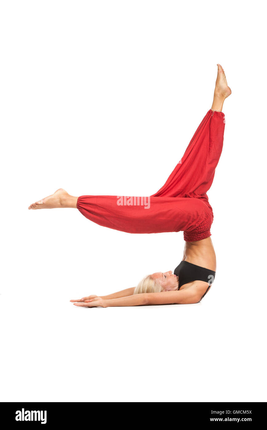 Practicing Yoga. Young woman isolated on white background Stock Photo ...